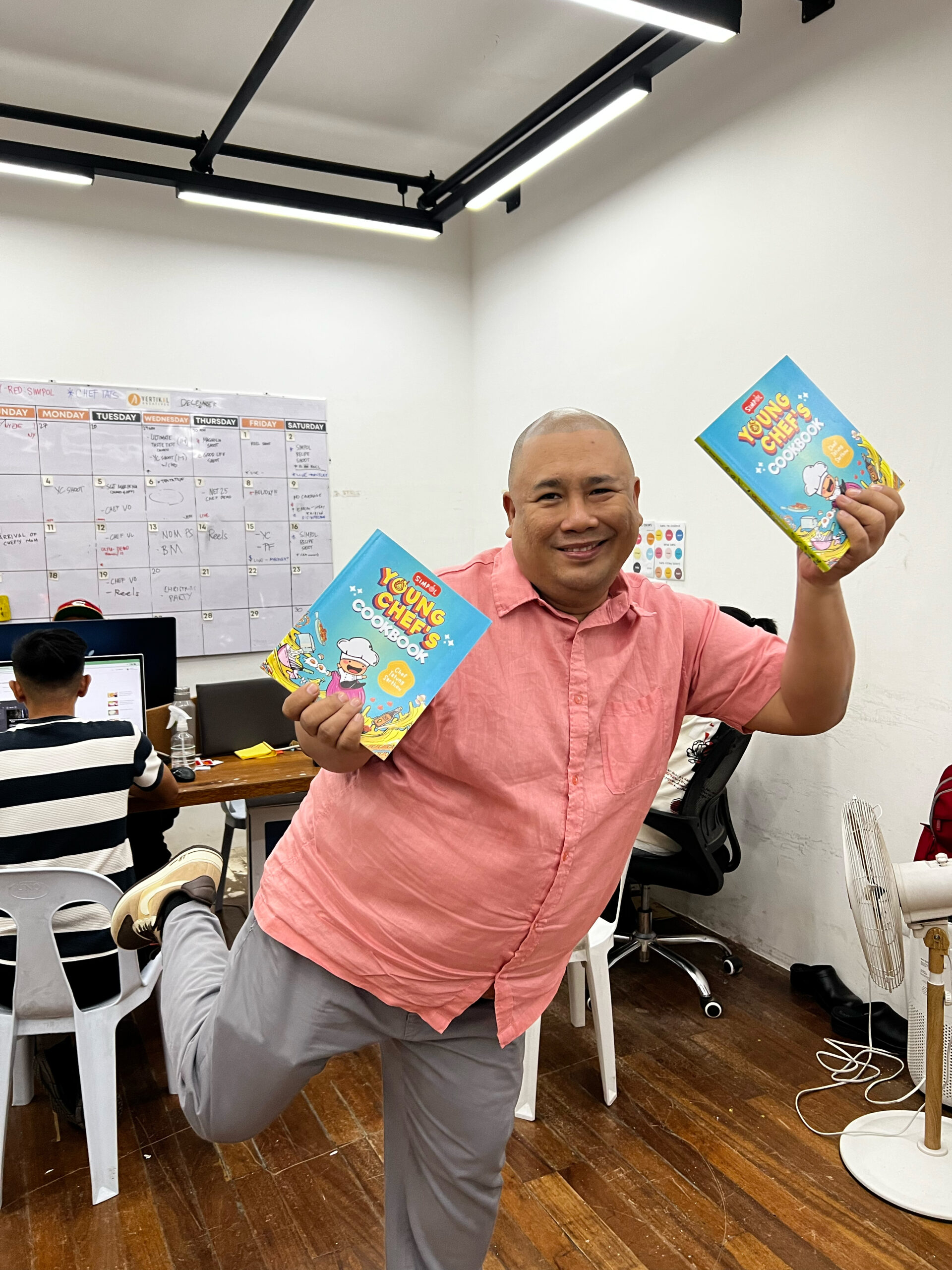 Chef Tatung Holding Young Chef's Cookbook